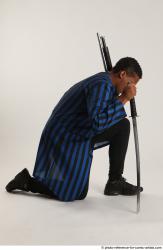 Garson KNEELING POSE WITH SHOTGUN